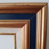Framed black gilded wood and cream fabric