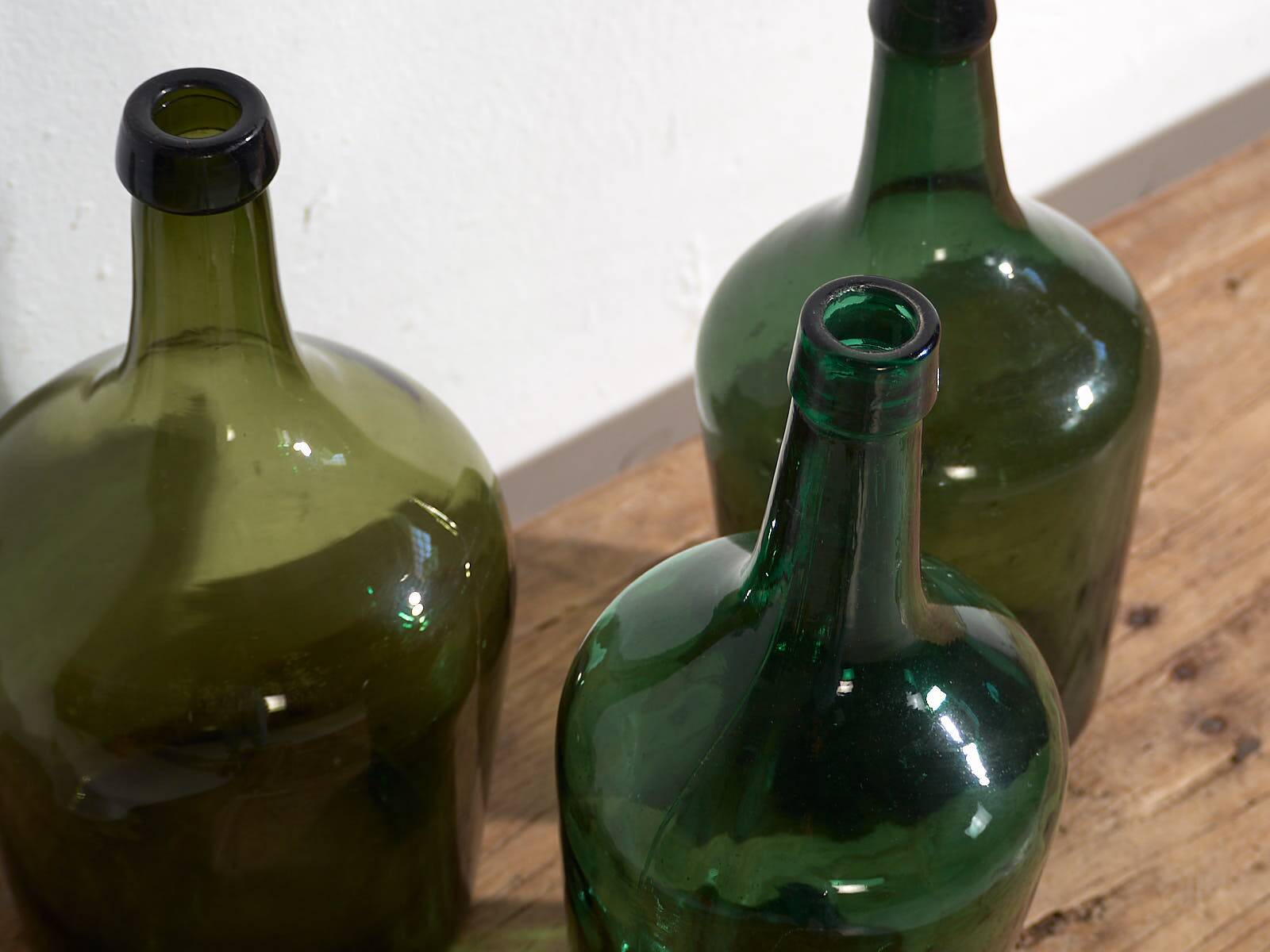 Antique green demijohns (c.1920). Set of 3 pieces