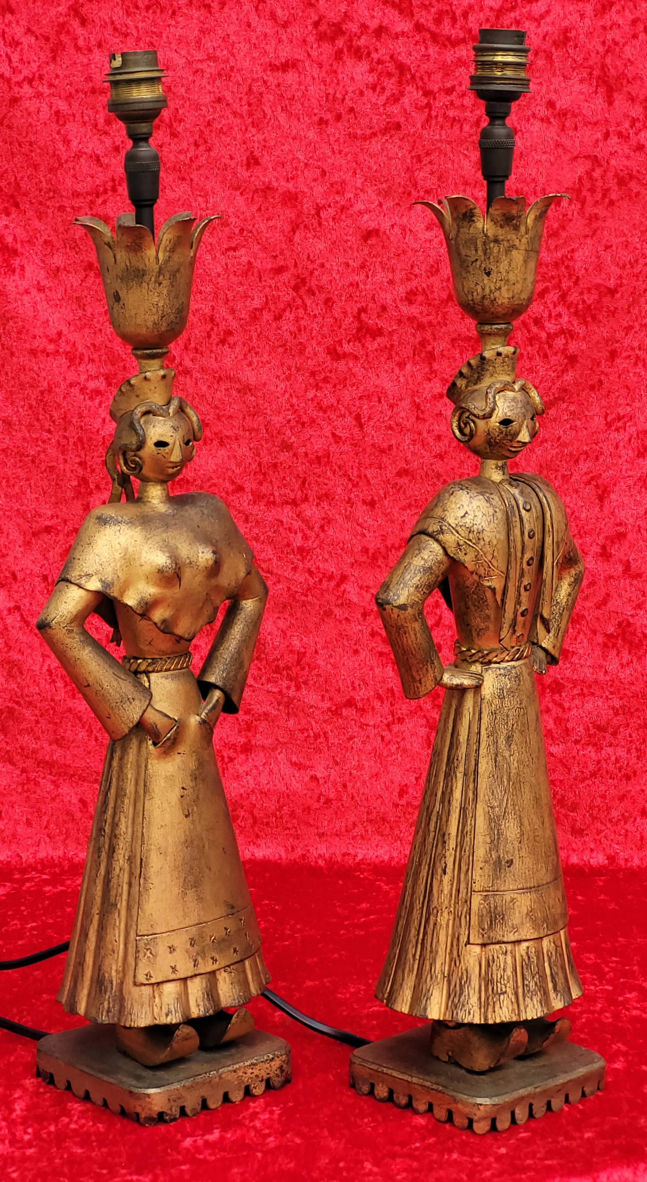 Pair of gilded beaten iron sculpture lamps attributed to Gilbert Poillerat