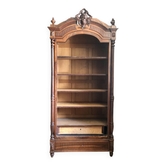 Antique wooden bookcase with pediment