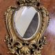 Miroir au putto style Louis XV Rocaille en bronze doré