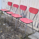 Red / pink formica table and its 4 chairs, vintage 70s.