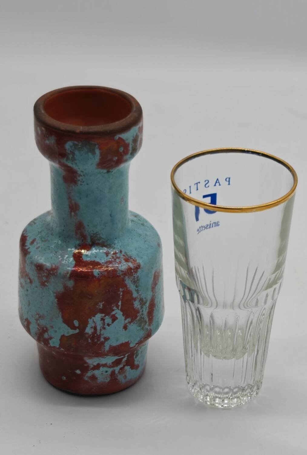 Small designer vase in oxblood red and turquoise blue