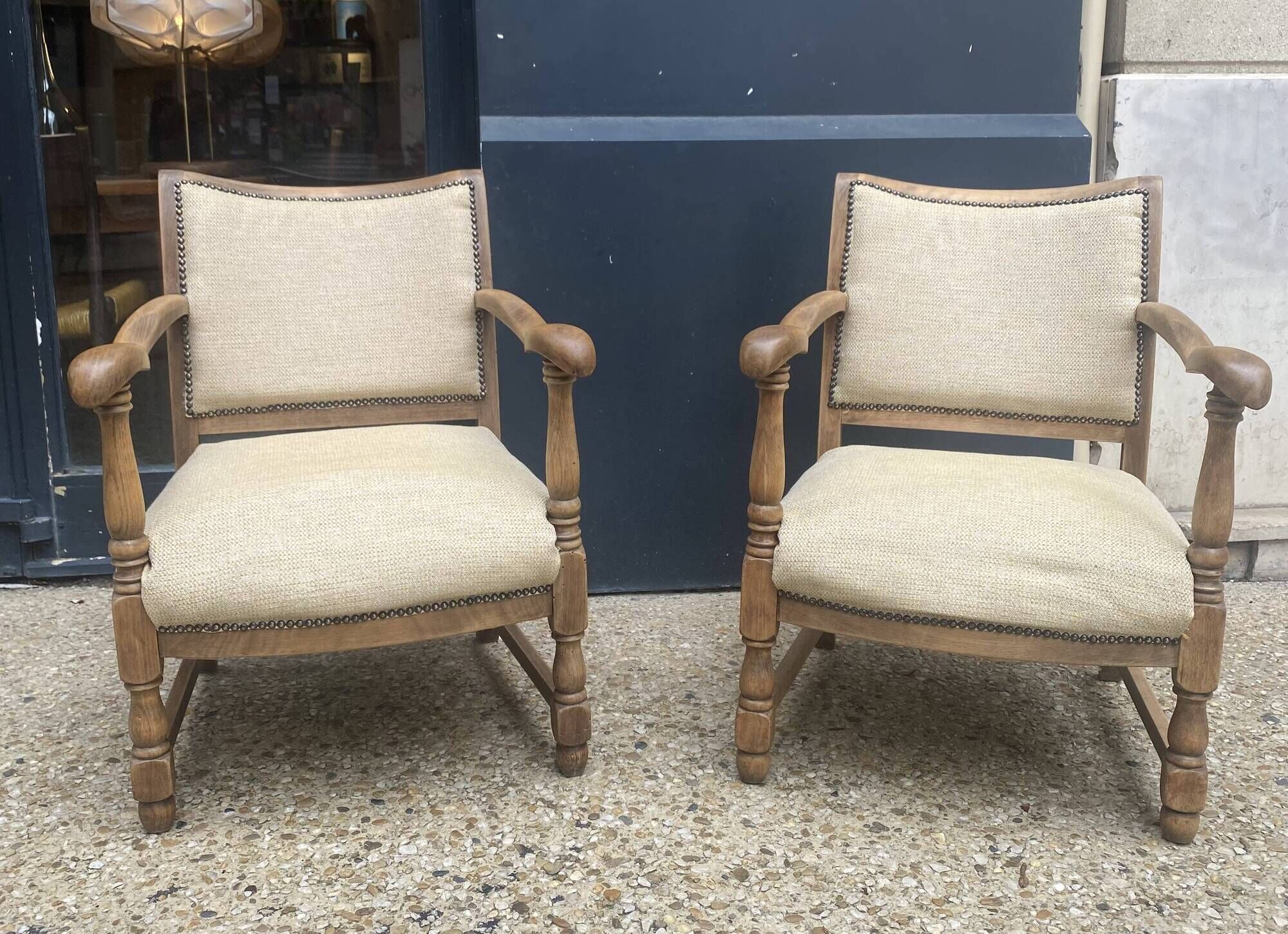 Pair of wooden and cream fabric armchairs