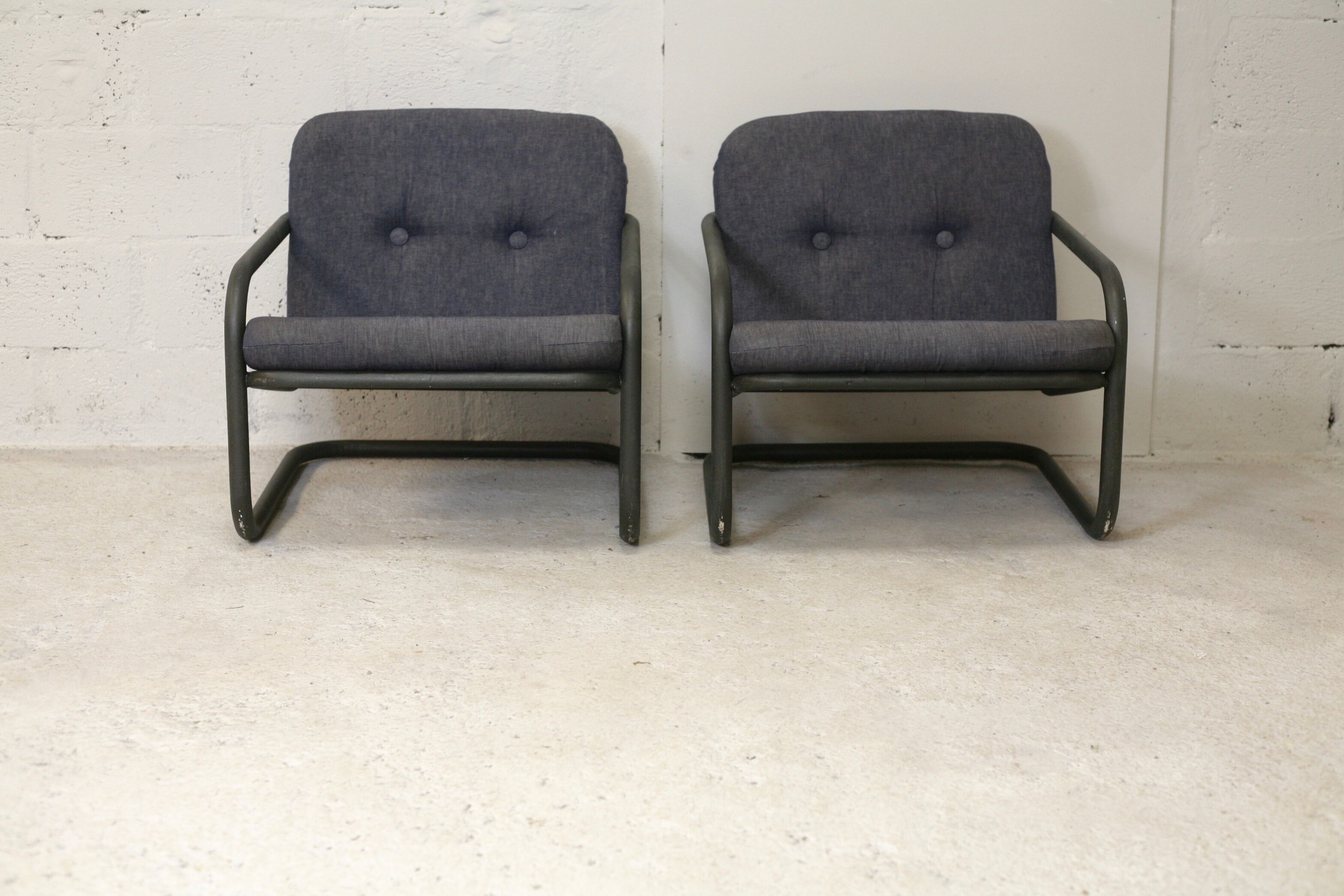 Pair of Prisunic edition armchairs, tubular steel and foam cushions, France, 1973