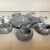 Eight grey-white marble candlesticks