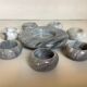 Eight grey-white marble candlesticks