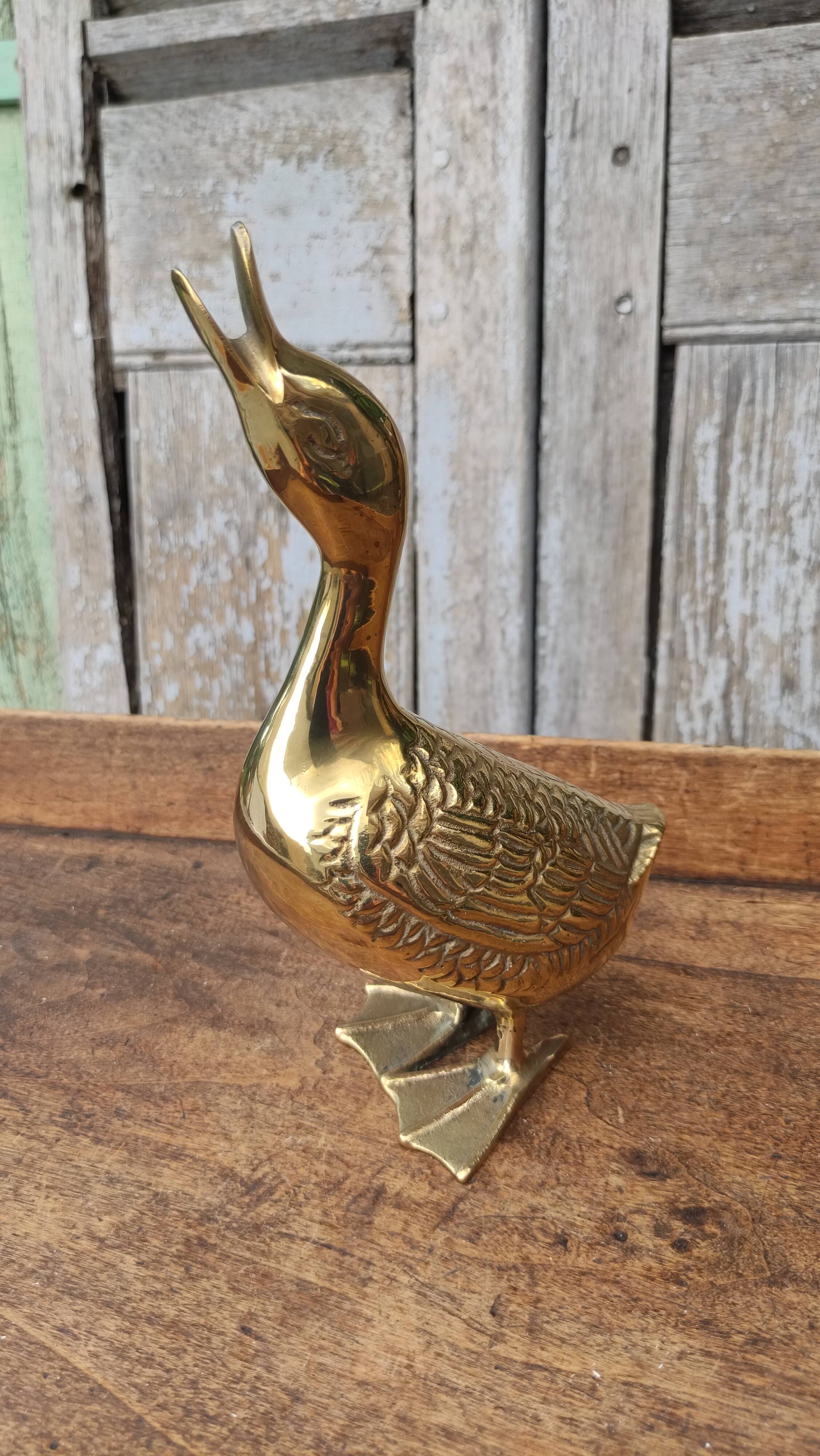 Large vintage duck in golden brass