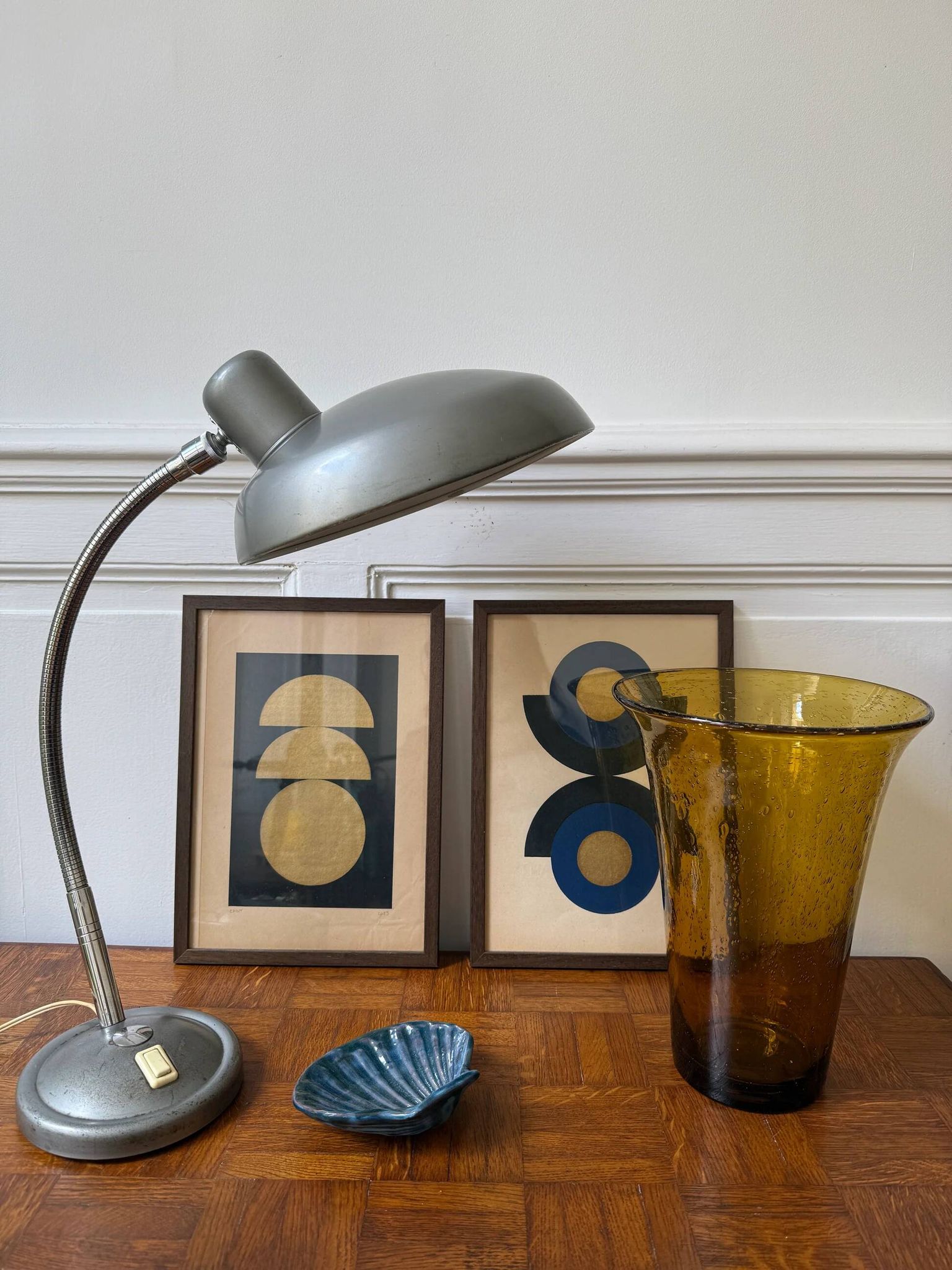 Industrial metal workshop lamp with a gooseneck.