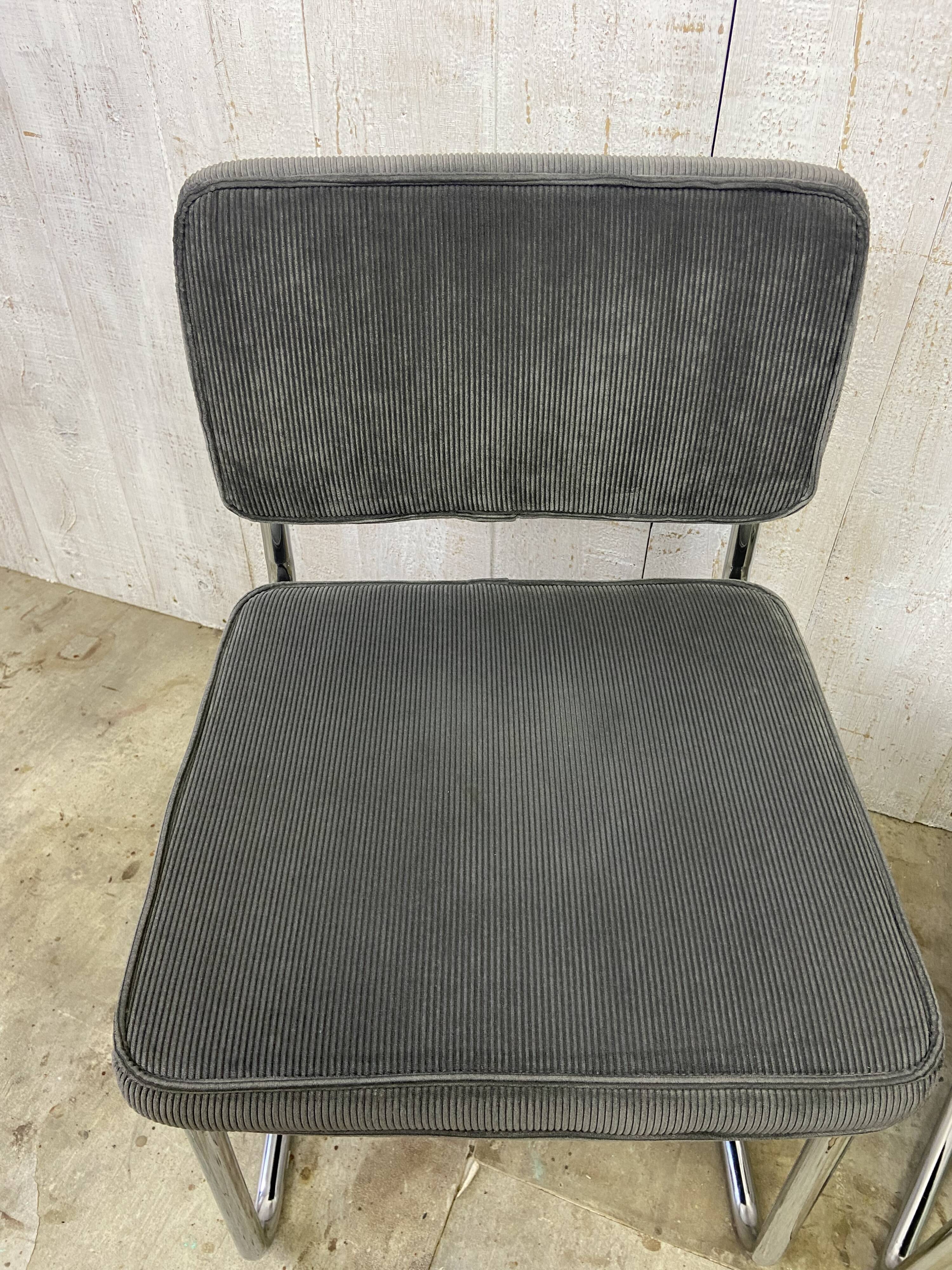 Pair of chrome and velvet chairs