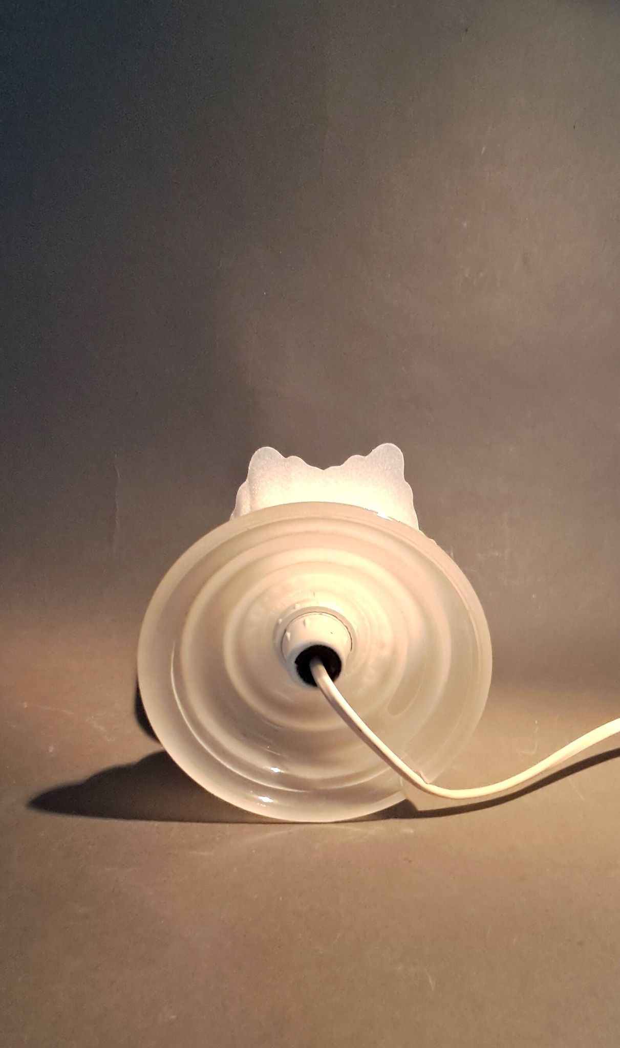 Art Deco style 1960s bedside lamp in molded and granite glass.