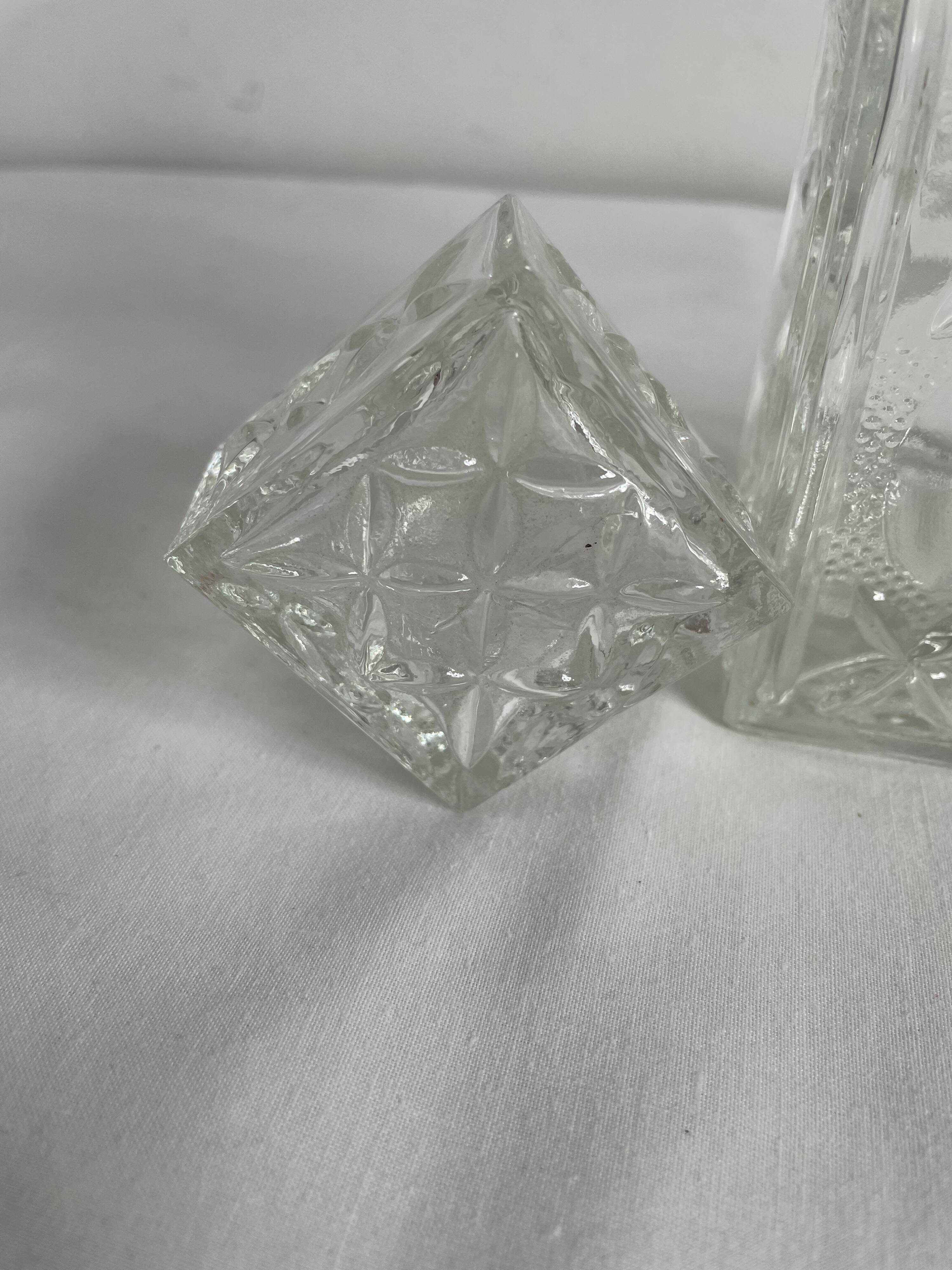 Molded glass carafe, 1960s-1970s, stylized flower decoration, oval, square base, stopper, rosette