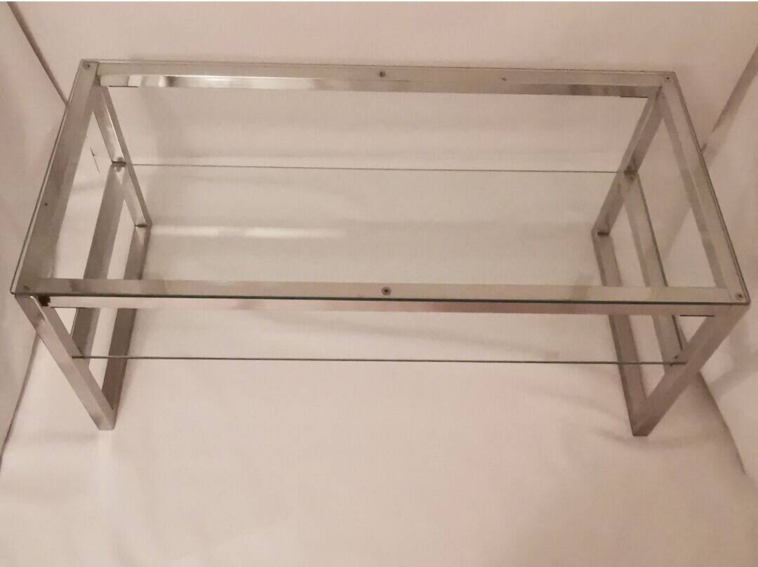 1980s coffee table with a double chrome metal top.