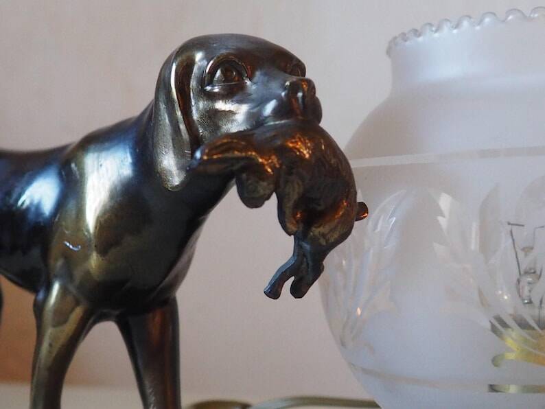 French Art Deco hunting dog on a marble base with a switched lamp.