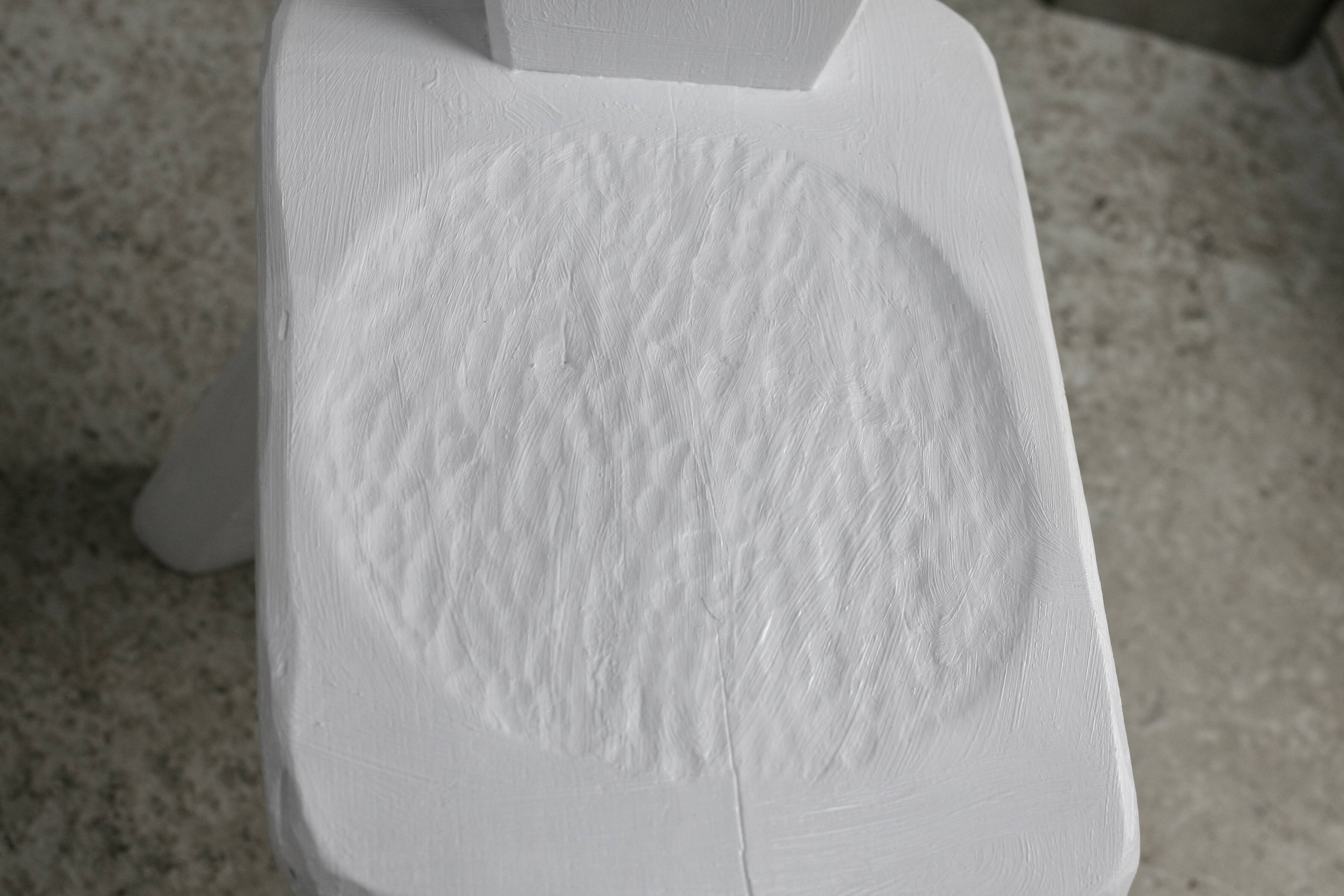 Pair of tripod chairs, gouged seats. Brutalist, circa 1960. Painted wood.