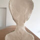 Bust of a woman in green and white plaster
