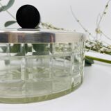 Vintage box made of chiseled glass and covered metal, taken in black Bakelite