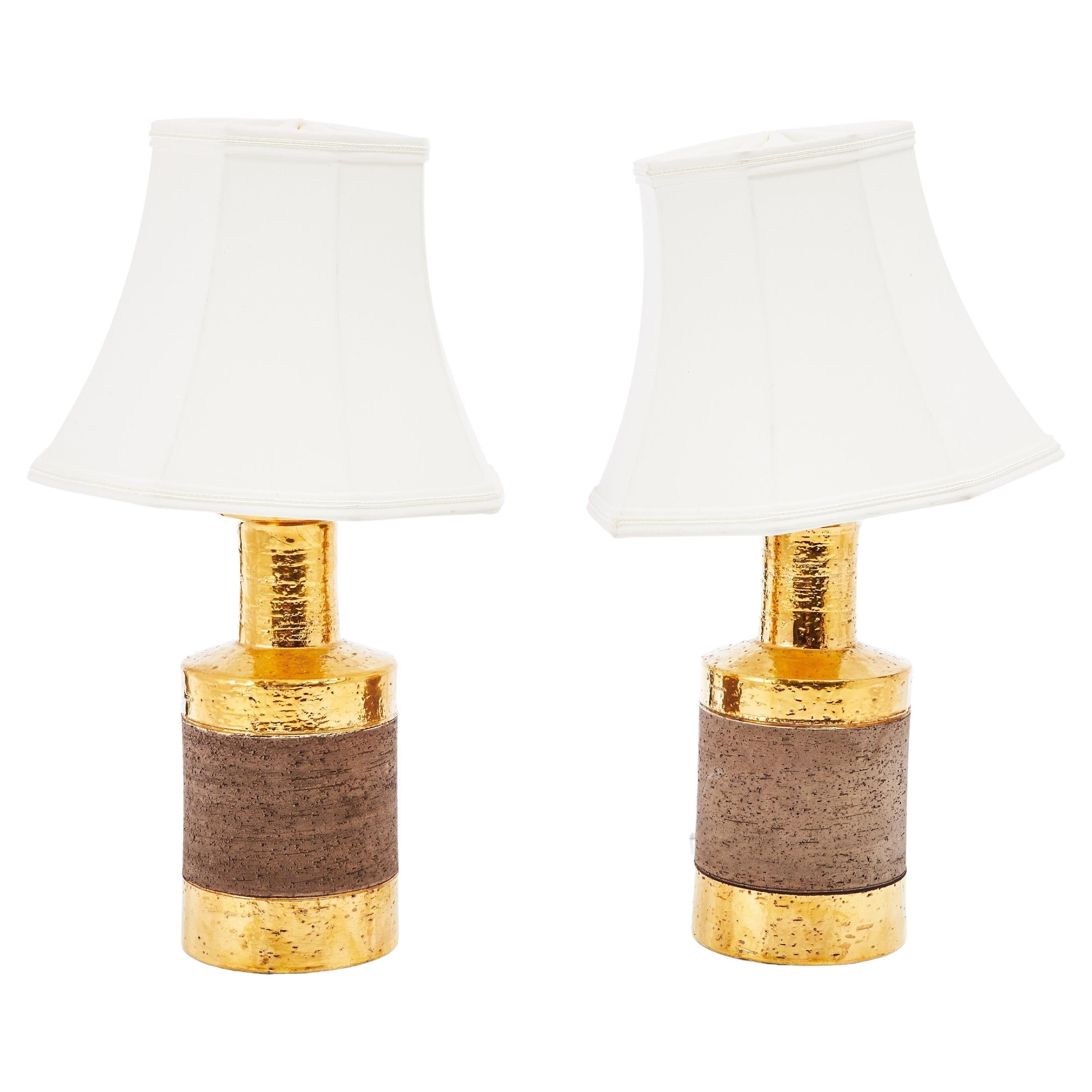 Pair of Bitossi table lamps in gilded ceramic, Italy, 1970.