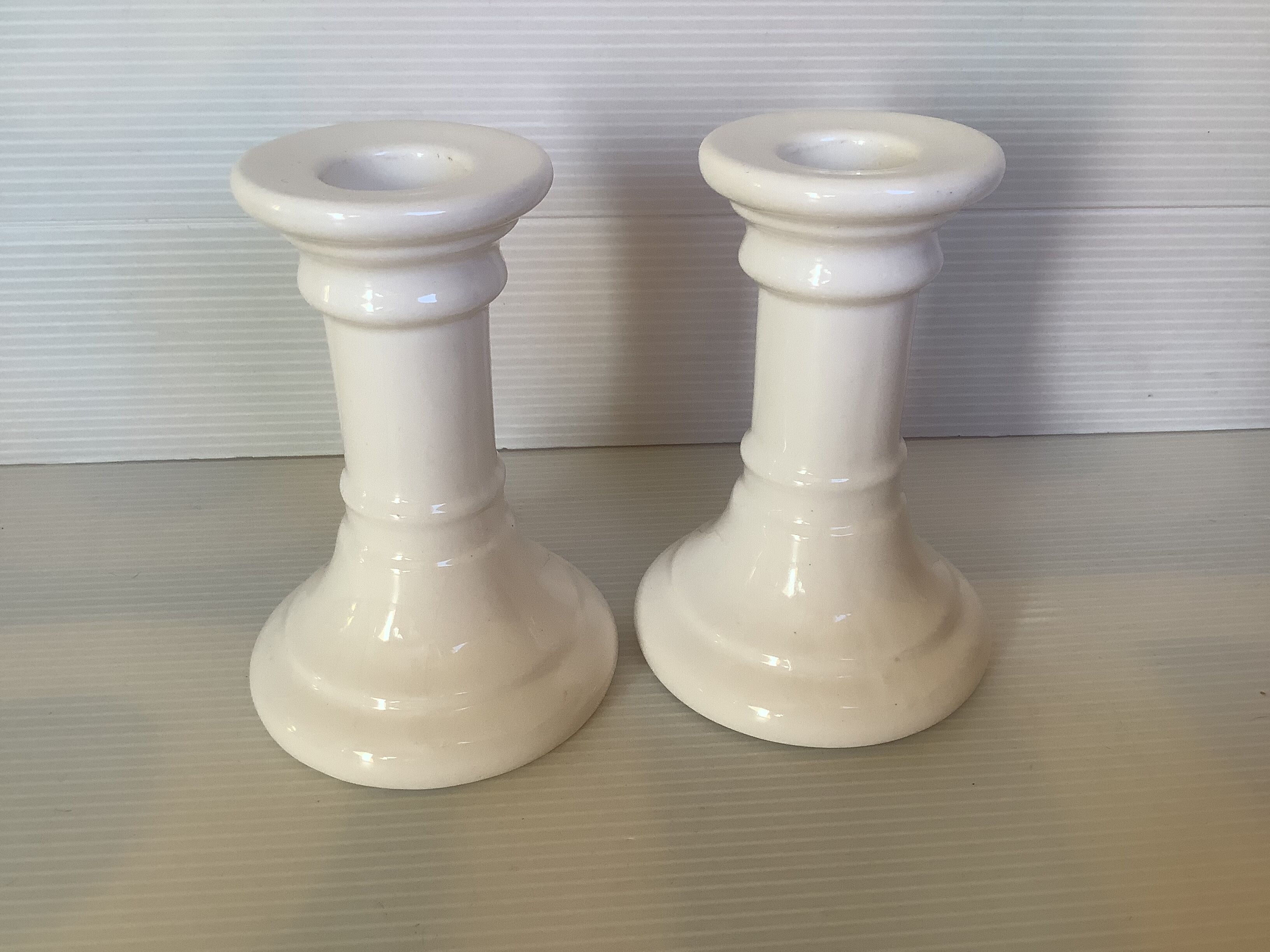 Pair of white earthenware candle holders