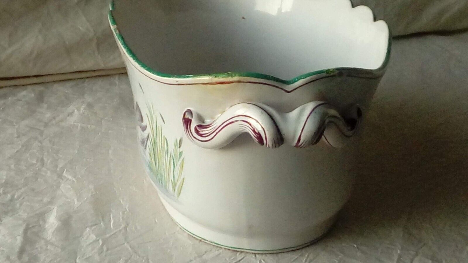 St Clement faience jardiniere with marine and swan decoration, early 20th century.