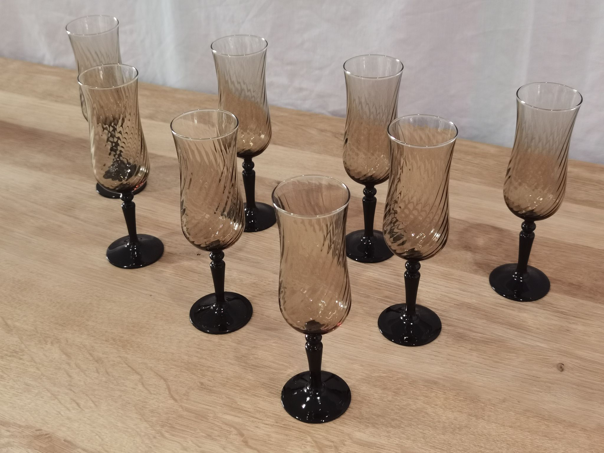 8 vintage smoked champagne flutes with black feet Arcoroc