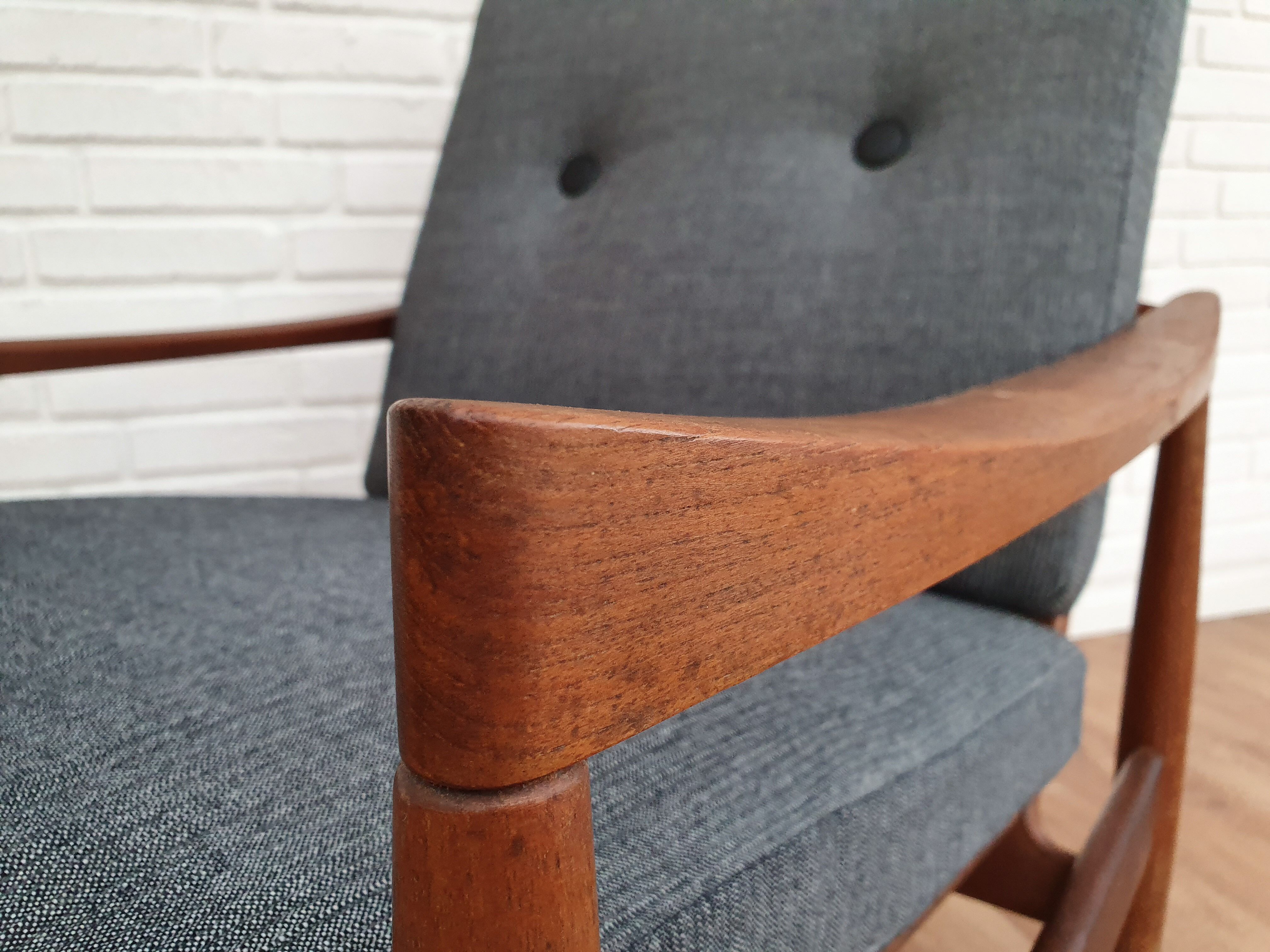 A pair of Danish armchairs, teak, wool, leather