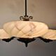 Art Deco bronze three-arm chandelier with marbled glass shades.