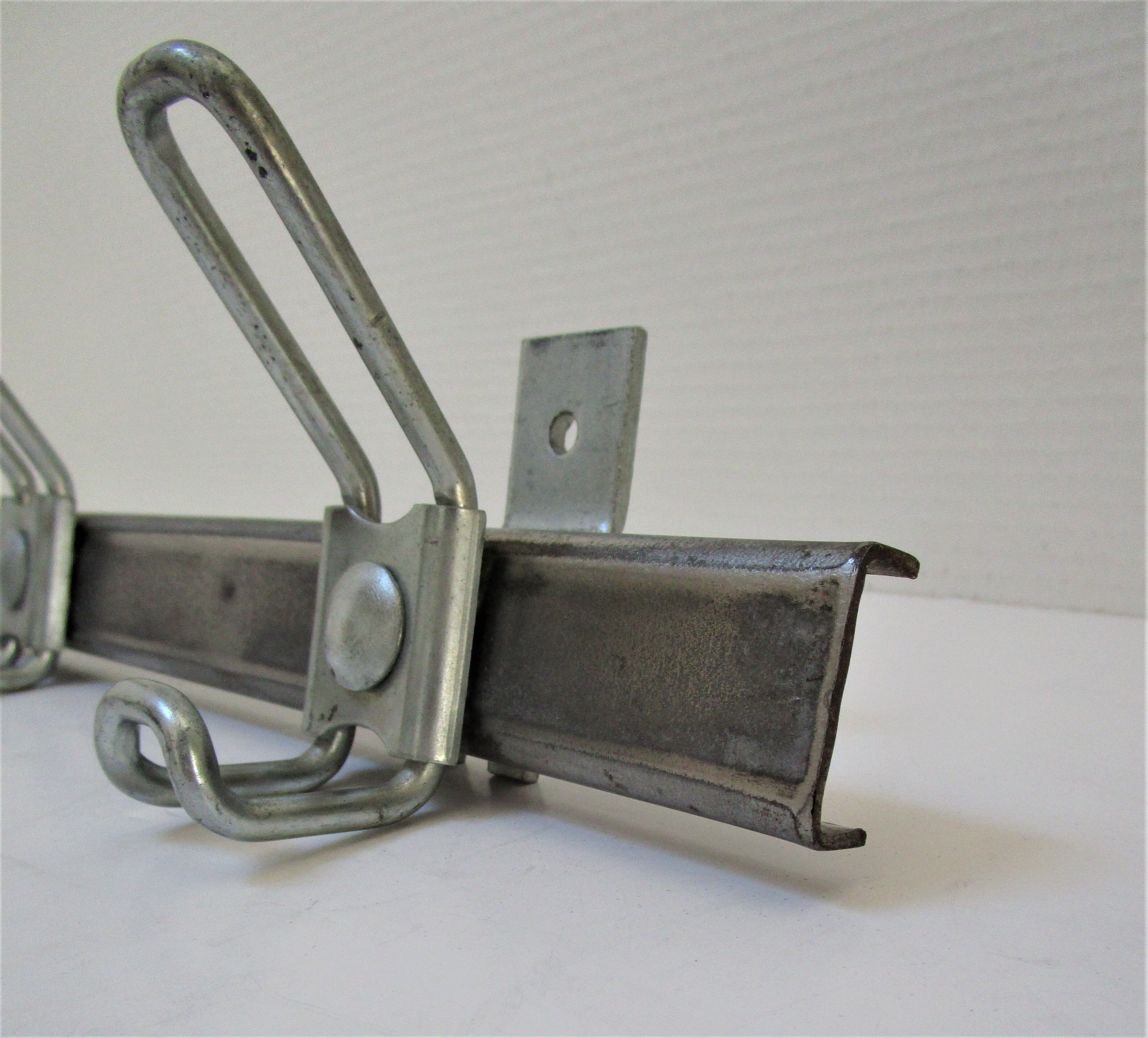 Vintage school wall rack in patinated steel