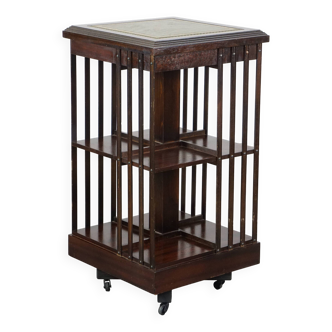 Wooden bookstand with green leather surface and on wheels in English style