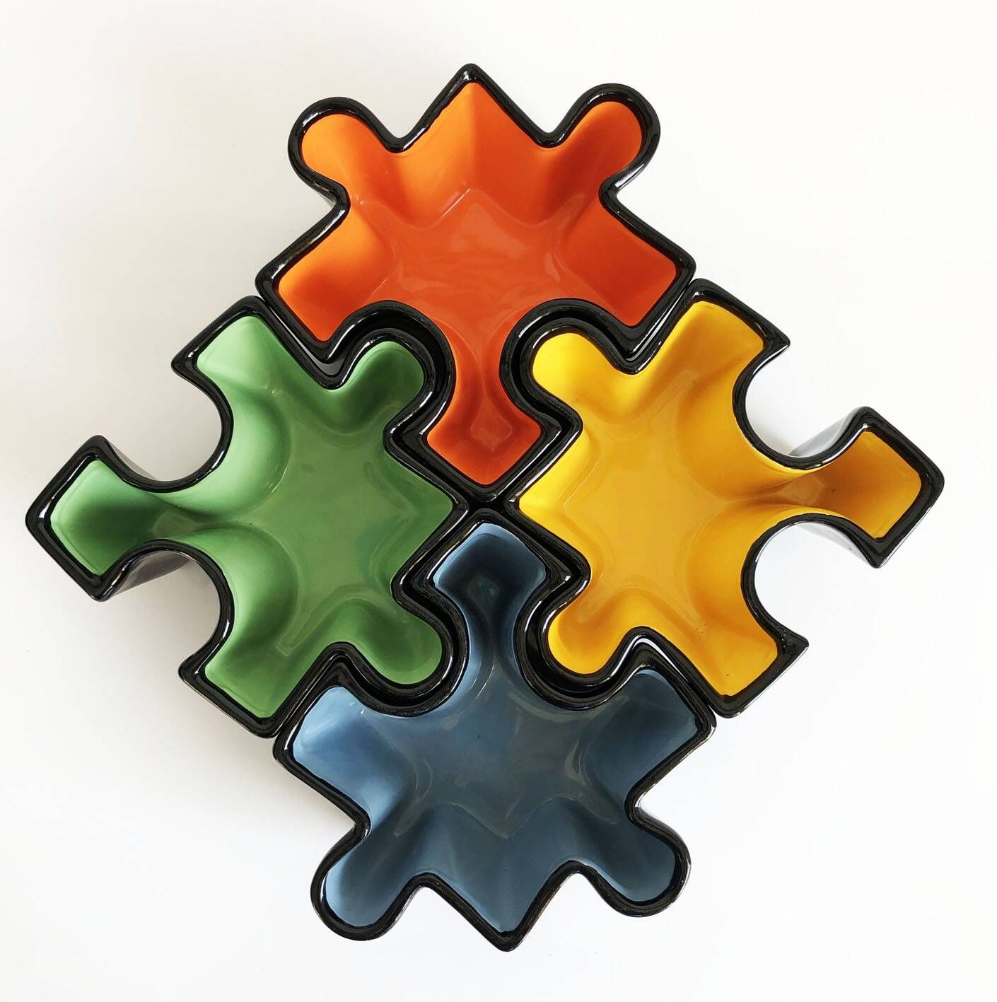Set of ceramic puzzle pocket trays. Italy, 1980s.