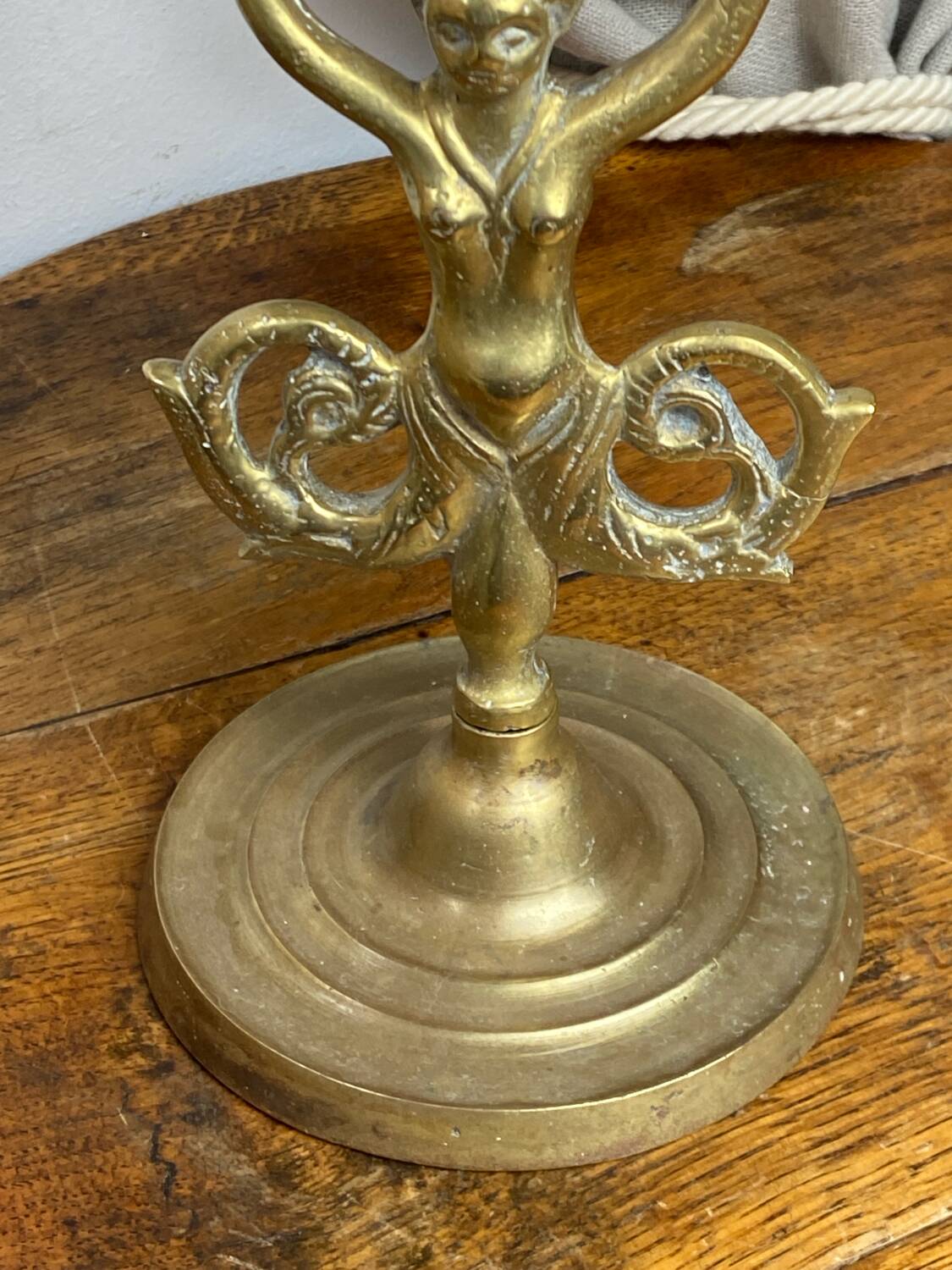 Mermaid-shaped chandelier in bronze