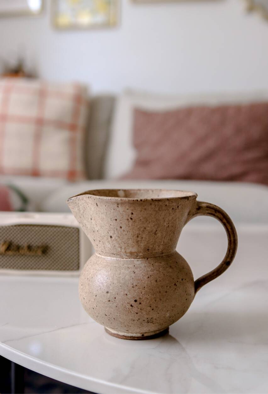 Small pitcher in old speckled stoneware