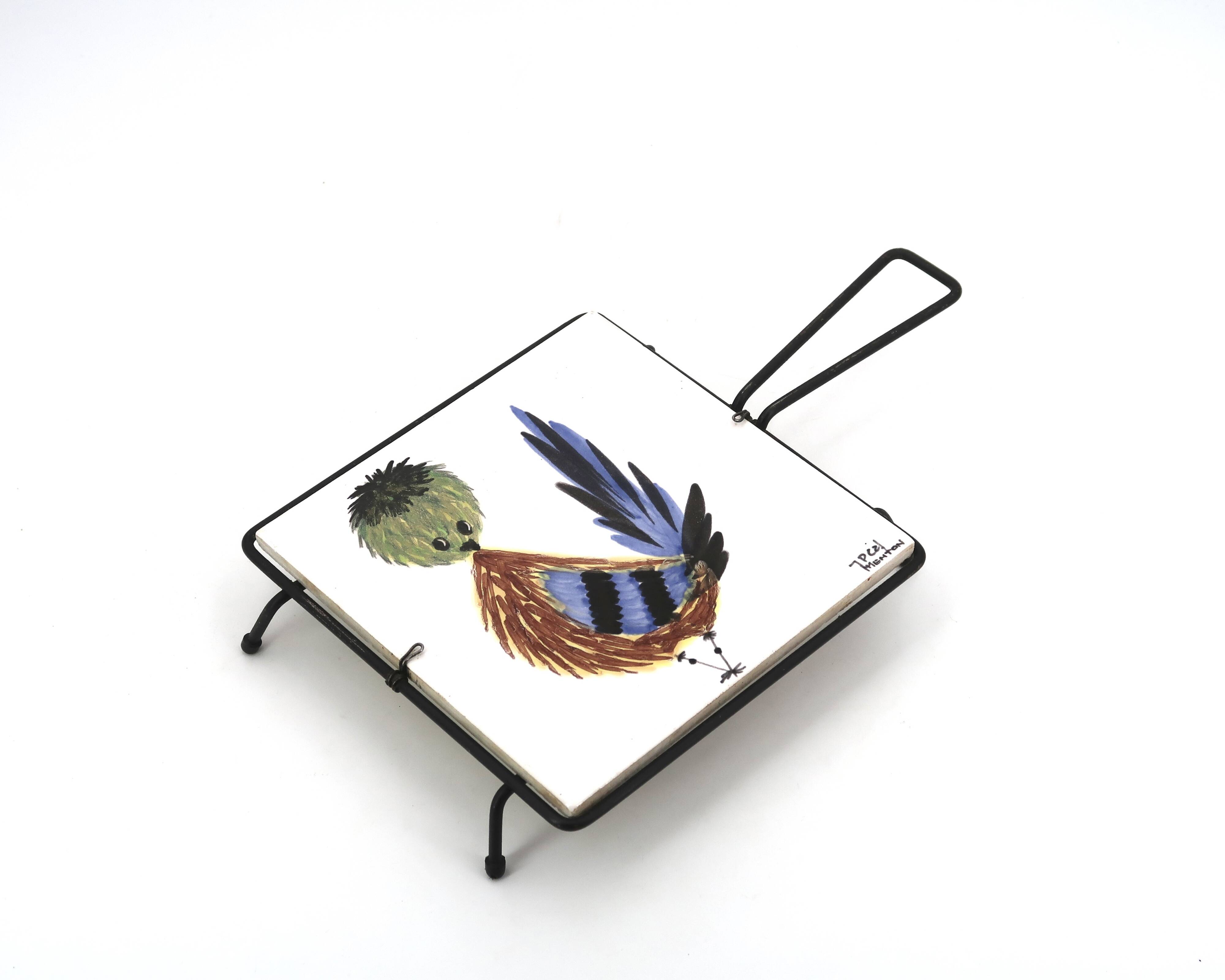 Square ceramic trivet with a bird by Jean Pierre Caffarelli.