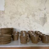 Set of stoneware coffee cups with saucers