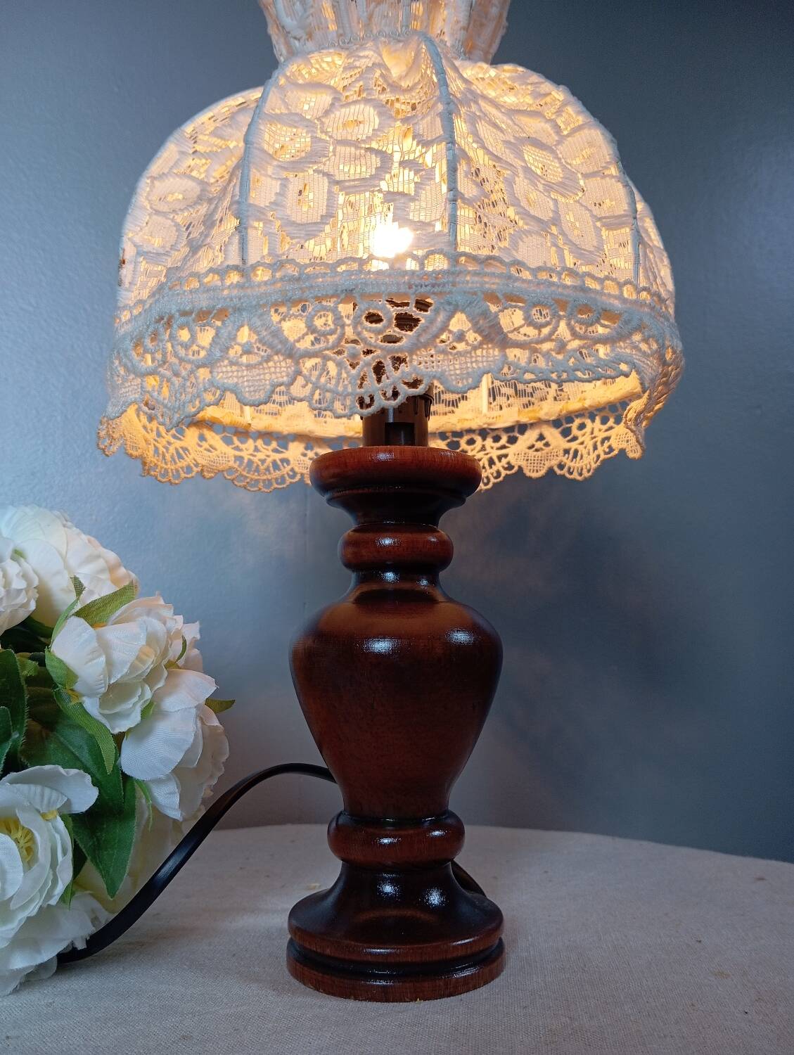 Table lamp with romantic wood and lace ambiance, retro chic