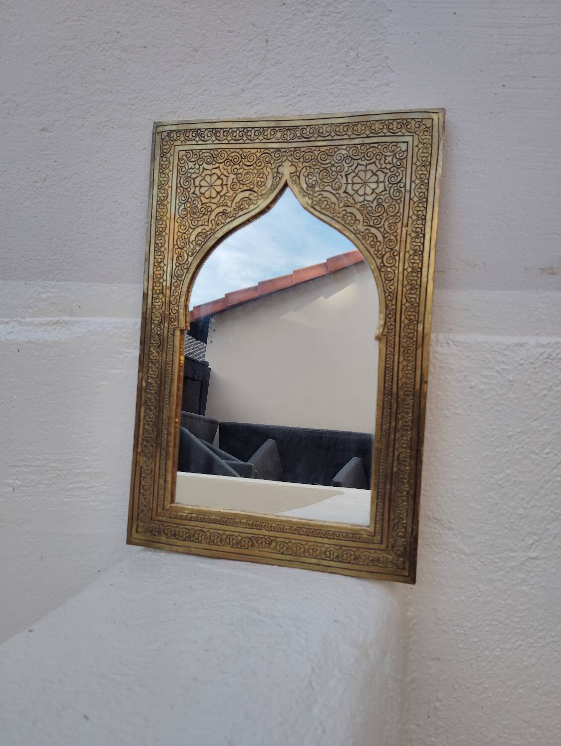 Golden oriental mirror