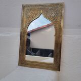 Golden oriental mirror