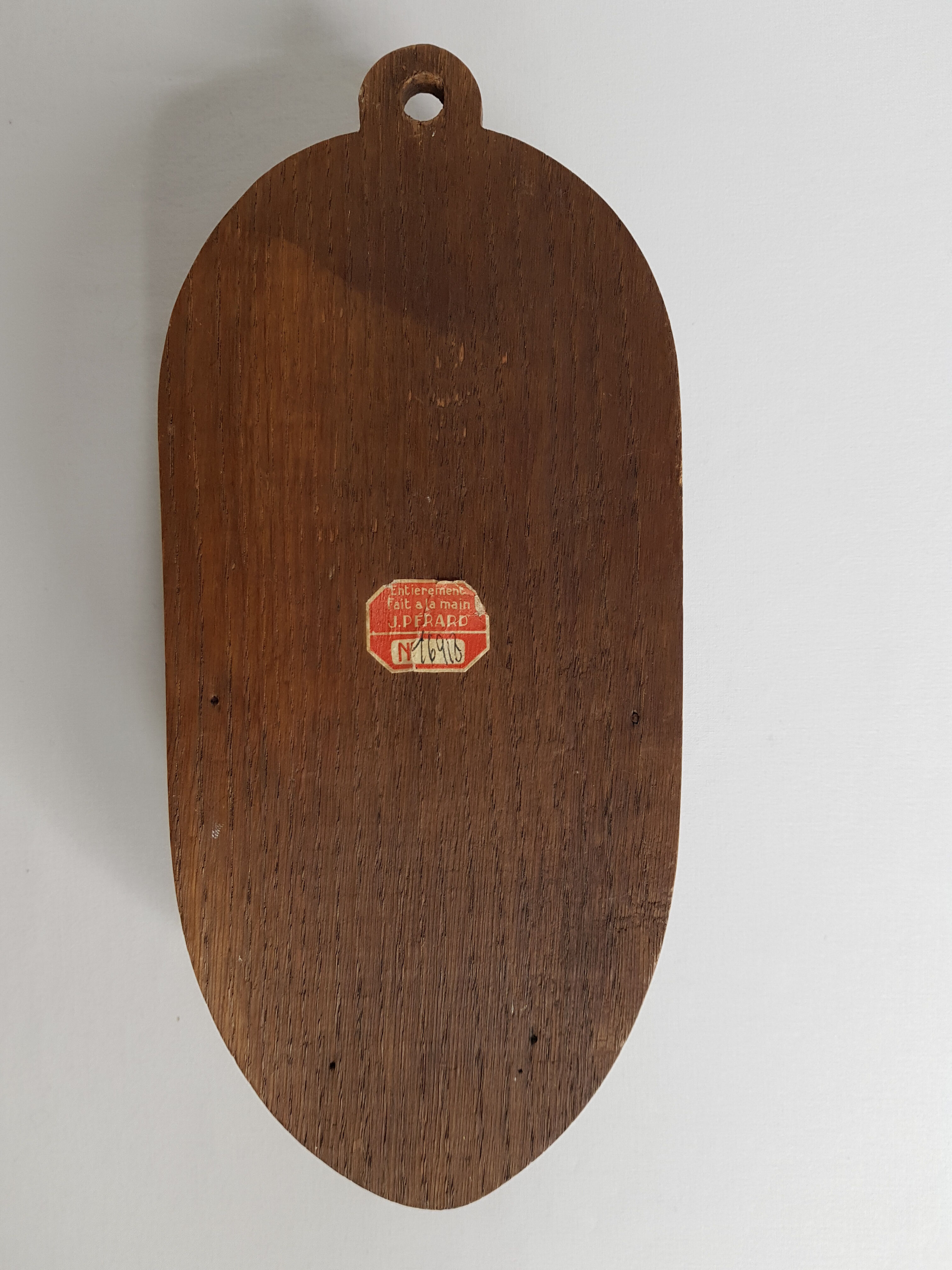 Carved wooden hood signed by J. Pérard and numbered 1900-1910