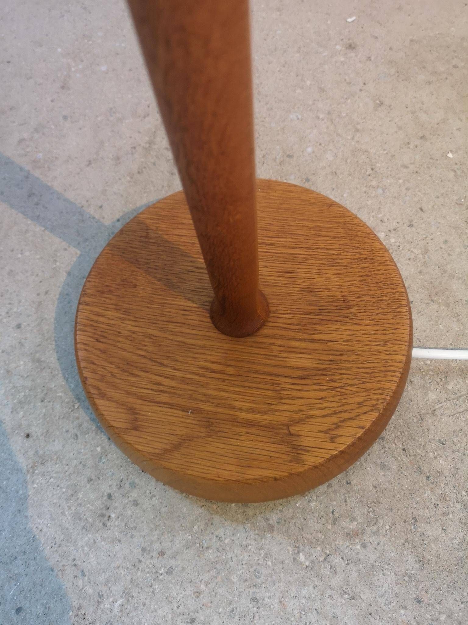 Mid-century floor lamp in teak and brass by Falkenbergs Belysning, Sweden, 1960s.