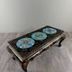 Black lacquered wooden coffee table with cloisonné and polychrome decoration, 20th century.