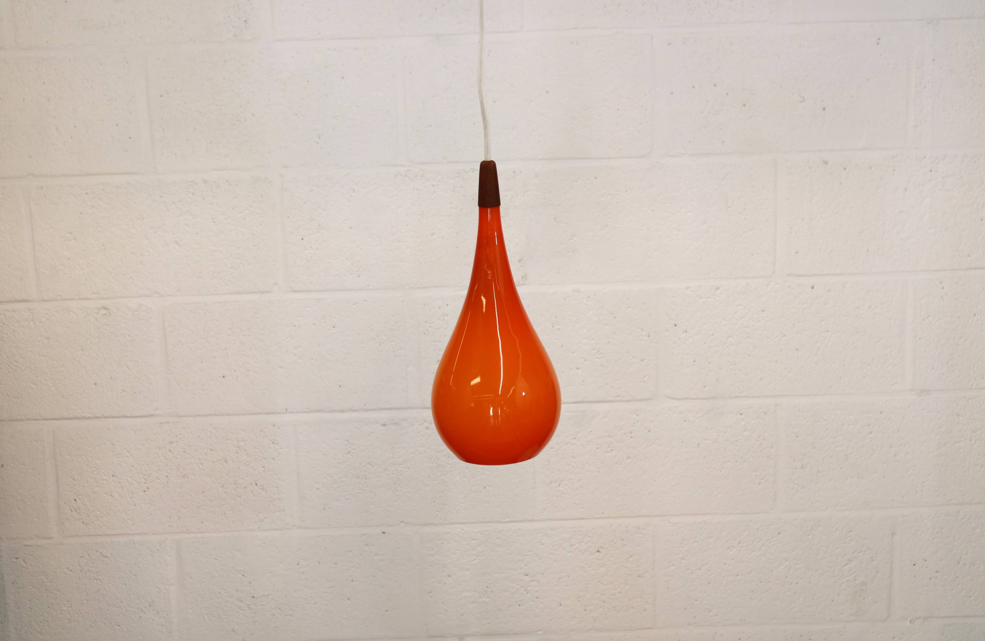 Orange teardrop glass pendant lamp made by Holmegaard - Denmark 1960