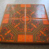Dessous de plat ancien en faïence orange vintage