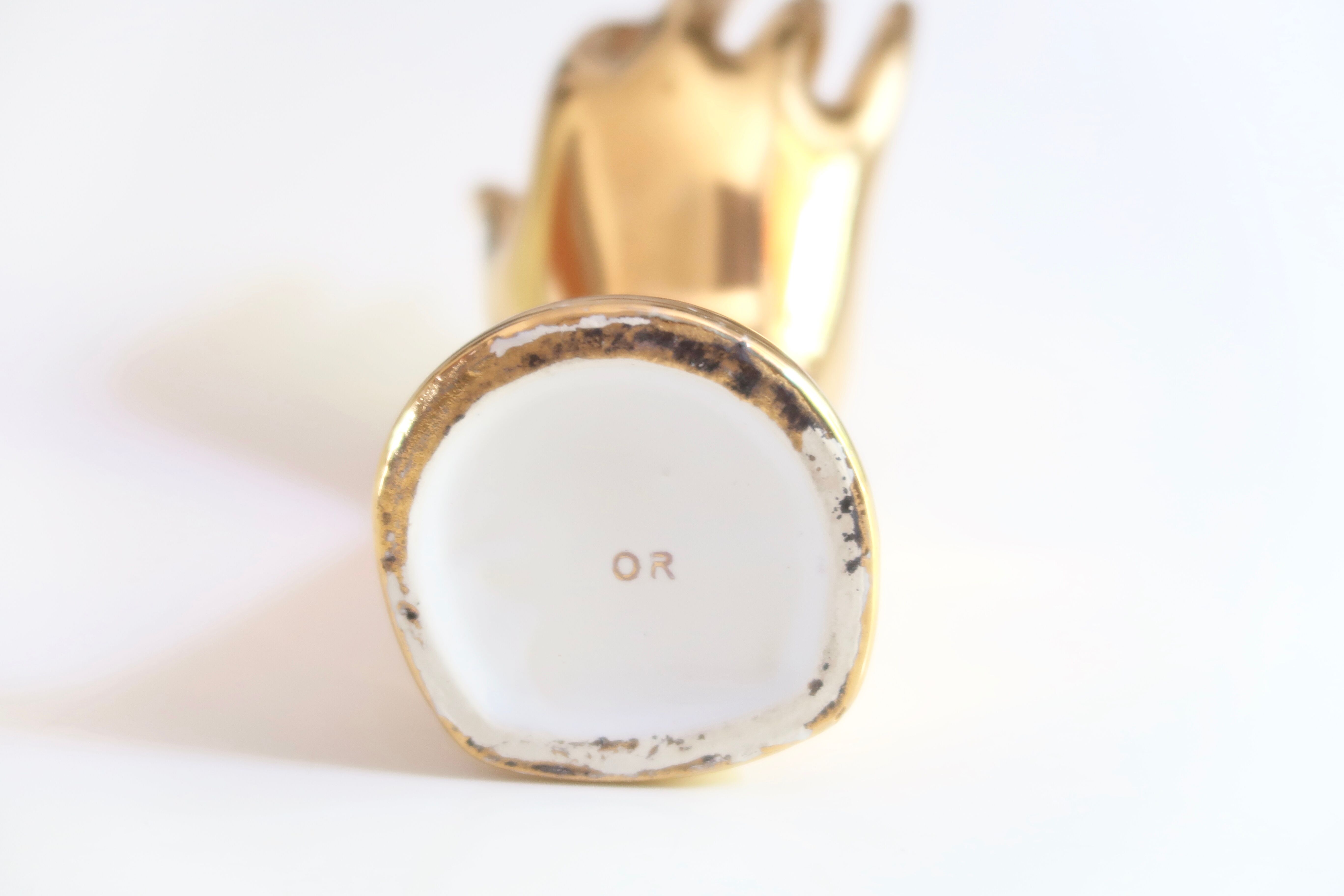 Golden porcelain fig hand, 70s