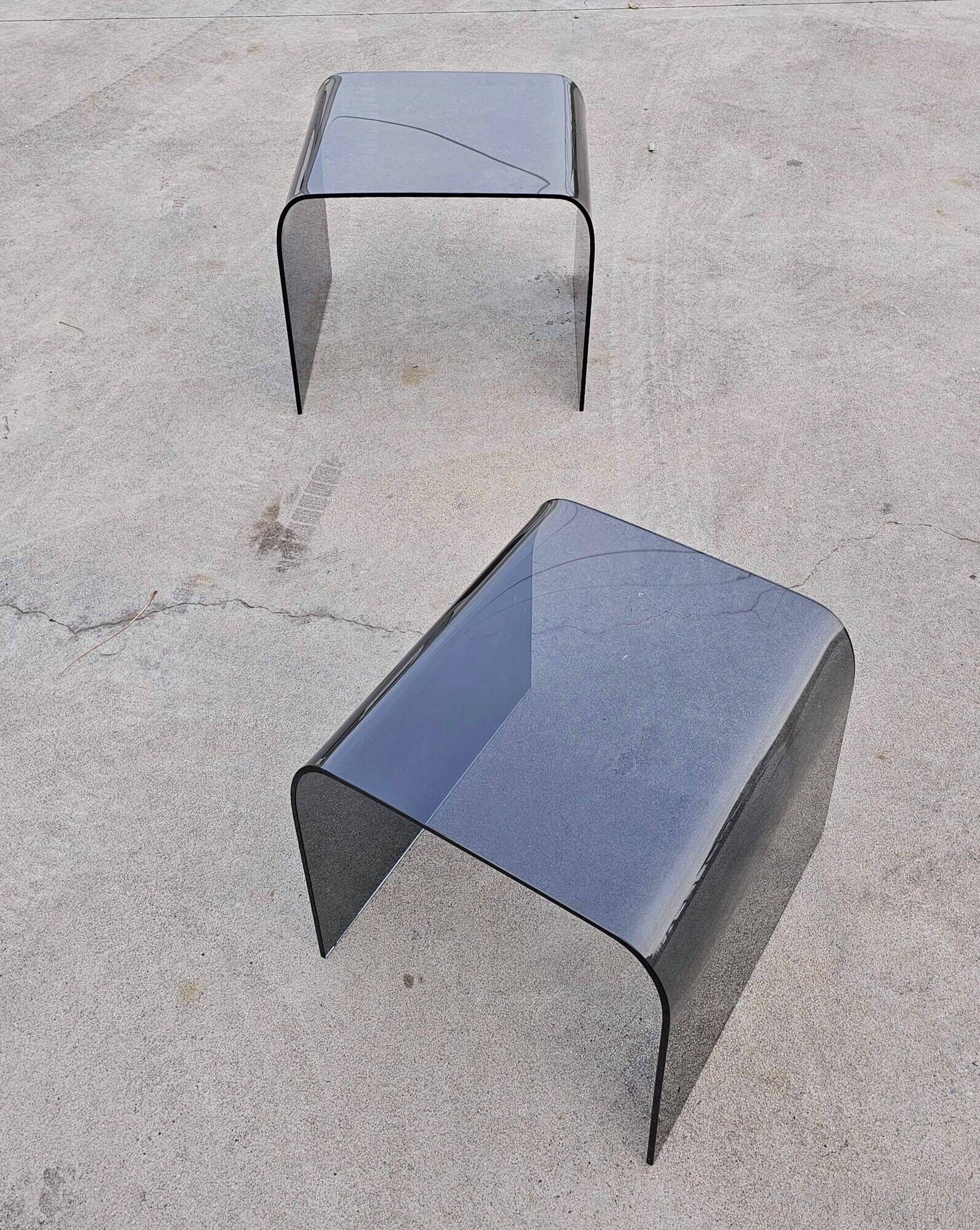 Pair of Waterfall nesting tables in tinted glass attributed to FIAM 1980s.