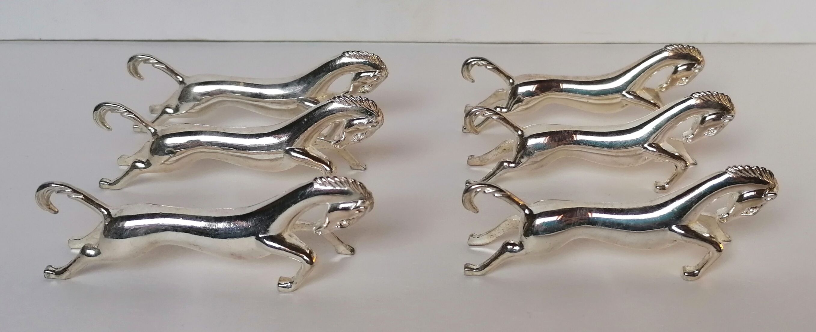 6 porte-couteaux métal argenté forme cheval