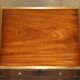 Pair of vintage military campaign high chests of drawers with leather tops.