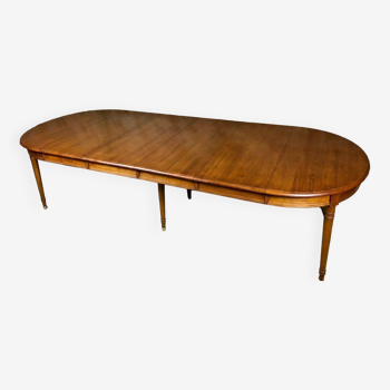 Oval walnut table with 6 legs from 1m12 to 2.94 (4 extensions of 45.5 cm)