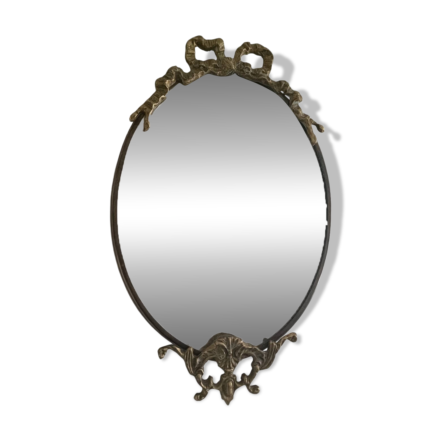 Antique mirror, oval with brass crest