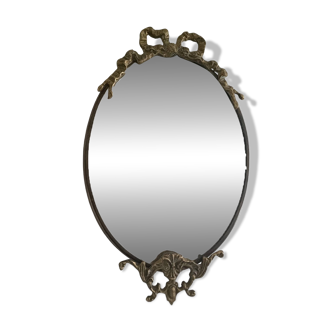 Antique mirror, oval with brass crest