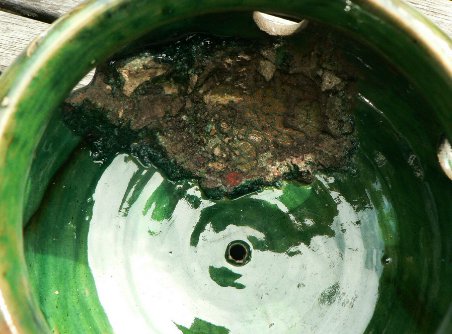 details on old bulb pot in glazed earthenware
